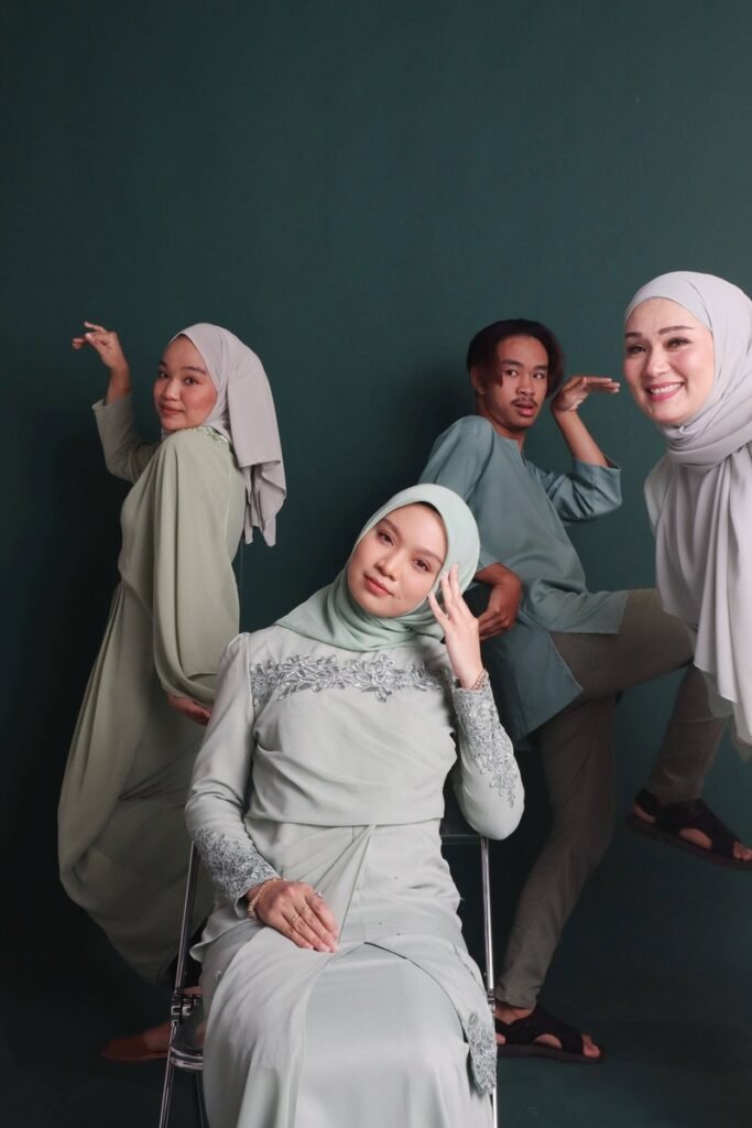 Malay best friend group photo funny with dark green background in photo studio