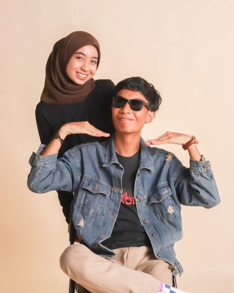 Malay couple photo with khaki background indoor
