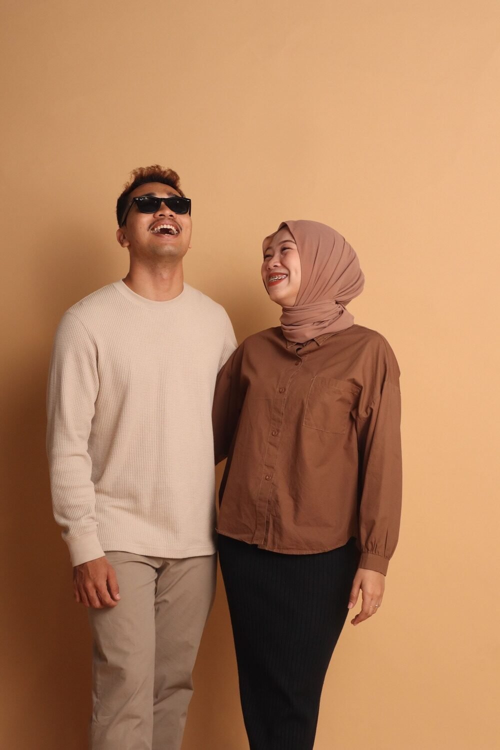 Malay couple photo with khaki background